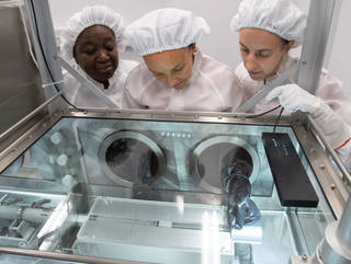 Date: 11-05-19 Location: Bldg. 31 - Lunar Curation Lab Subject: ARES team extruding Apollo lunar core sample. Pictured are from left, Andria Mosie, Charis Krysh and Juliane Gross Photographer: James Blair