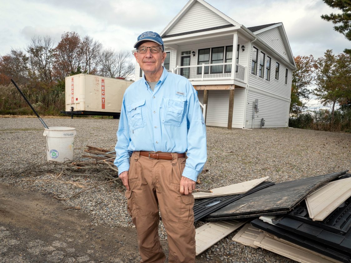 Kenneth Miller stands in front of a rebuilt home in Waretown, New Jersey, off Barnegat Bay. Shelley Kusnetz